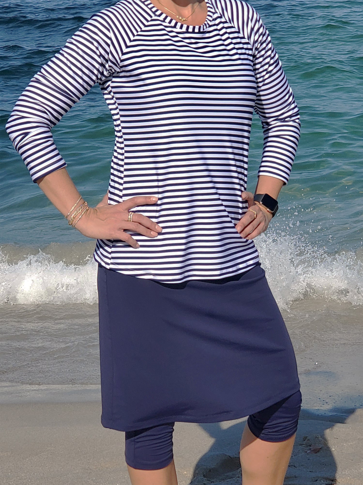 Women's active long skirt with built in capri leggings in navy blue.