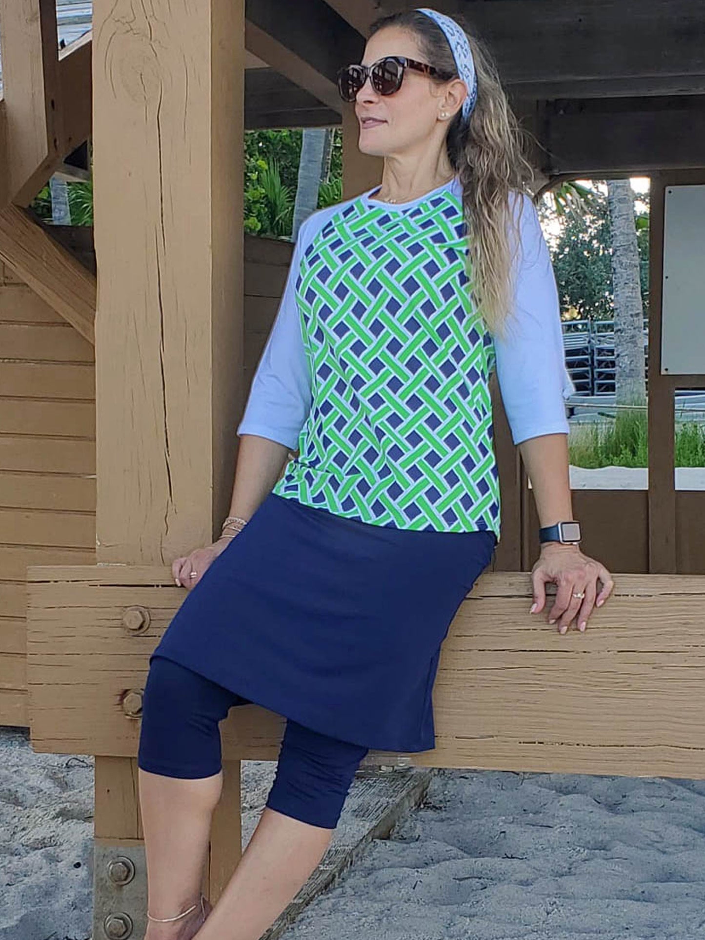 Women's long sleeve swim top in neon green and blue weave print.