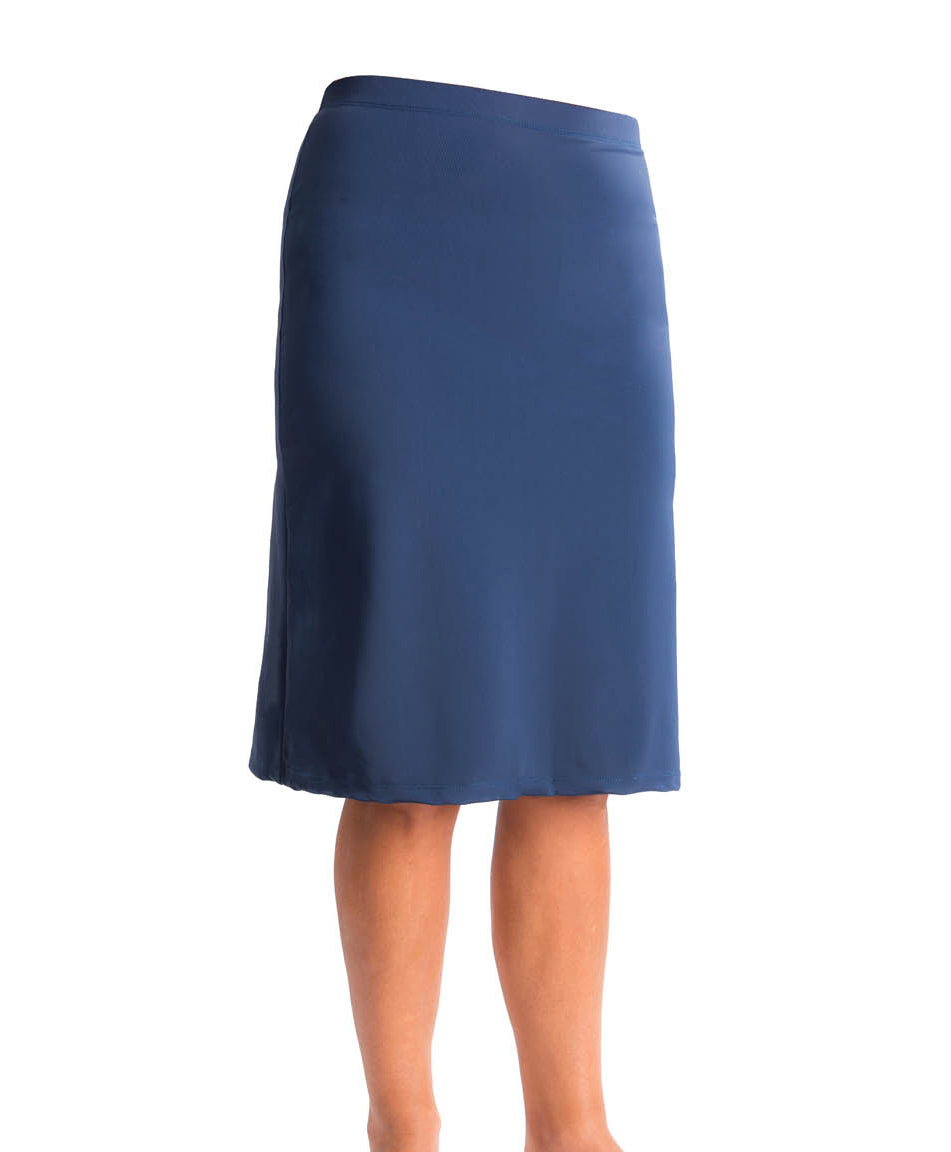 Women's active knew length skirt with built in shorts. Color navy blue.